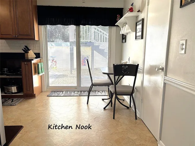 a view of a livingroom with furniture and a window