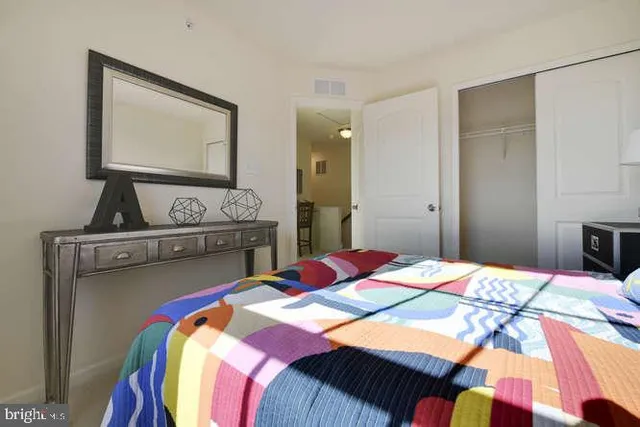 a bedroom with a bed and dresser