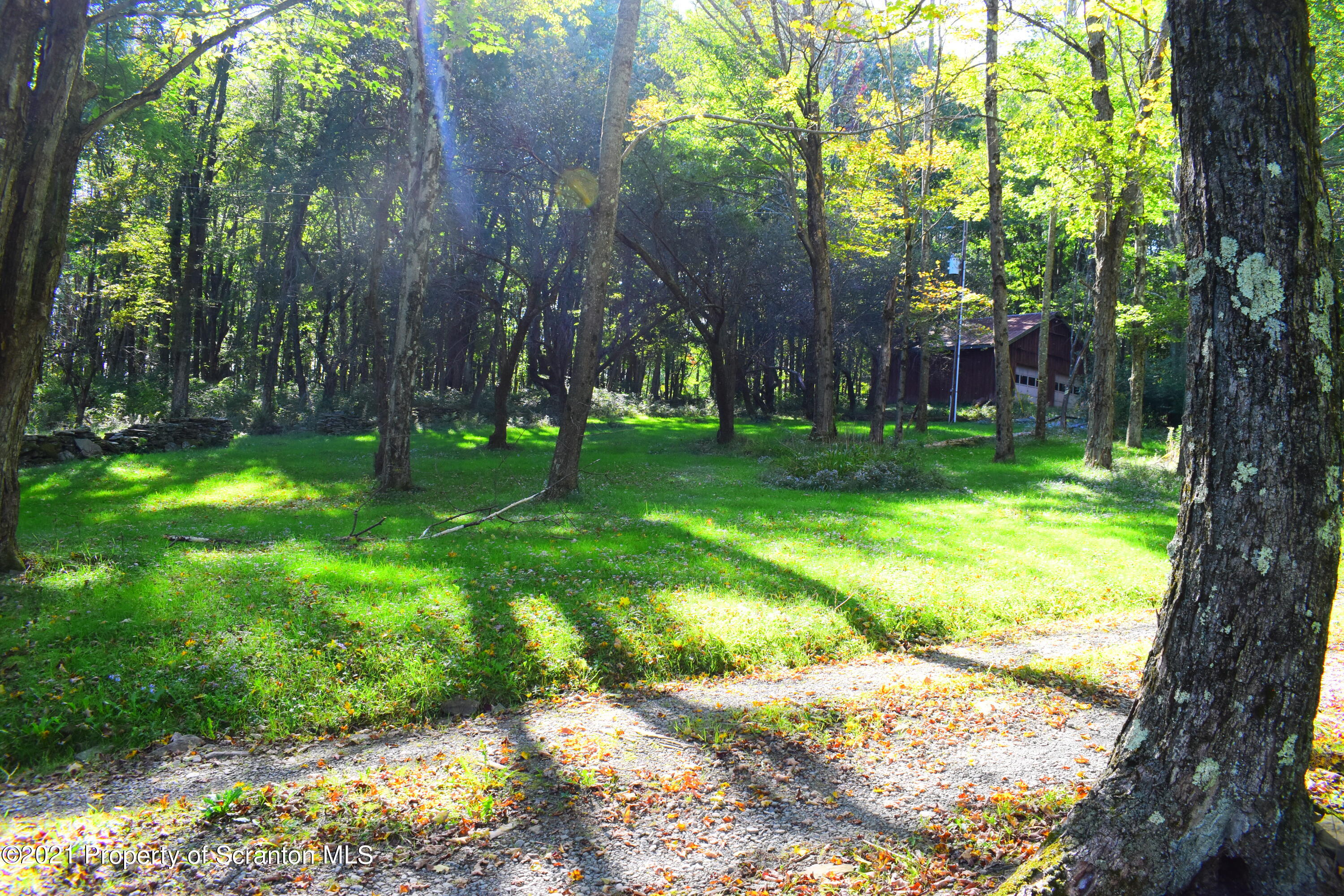 137 Conroy Road Montrose, PA 18801 - Photo 33 of 54 a backyard of a house with lots of green space and fountain