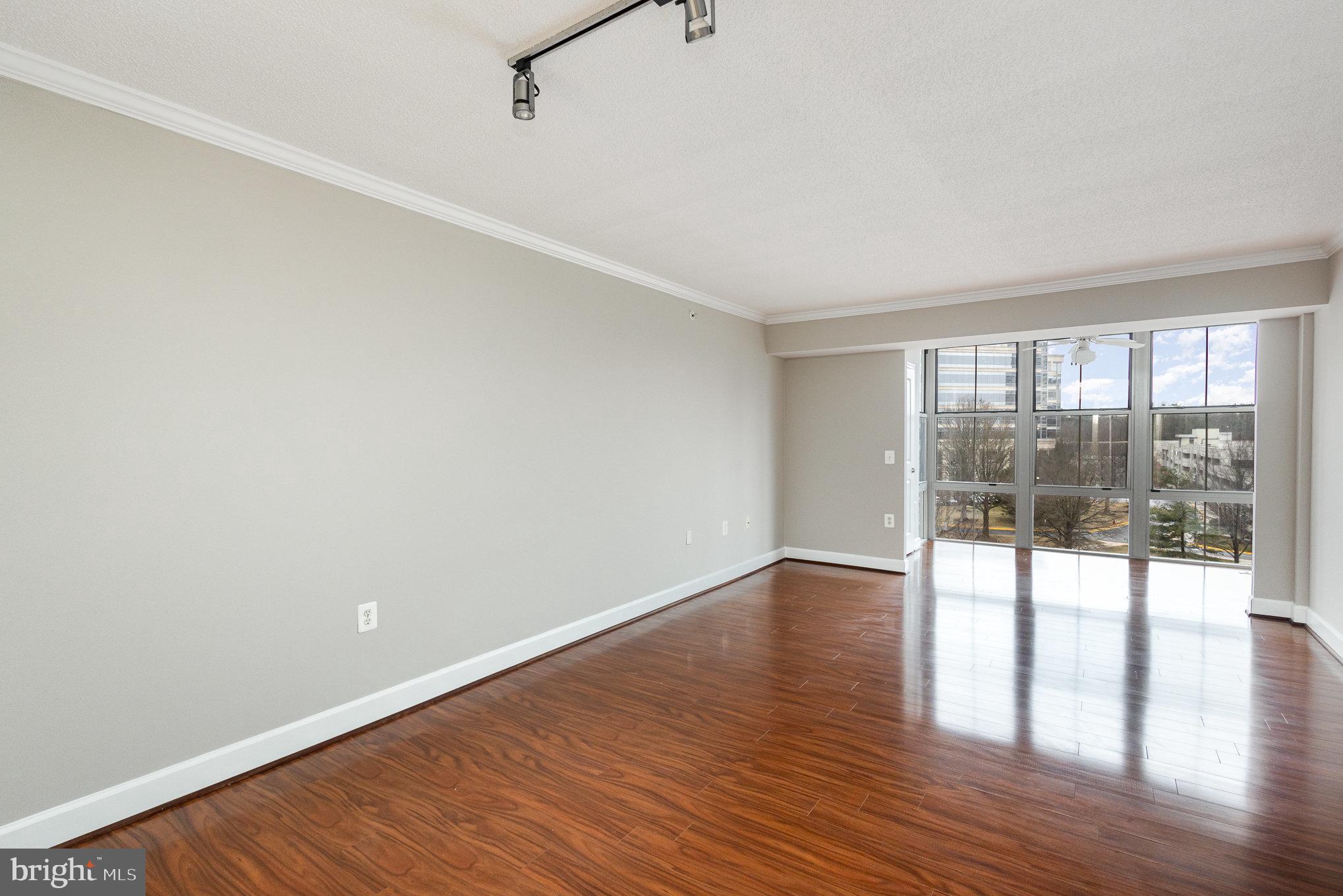 11800 Sunset Hills Road, Unit 619 Reston, VA 20190 - Photo 9 of 39 Living area flows into sunroom