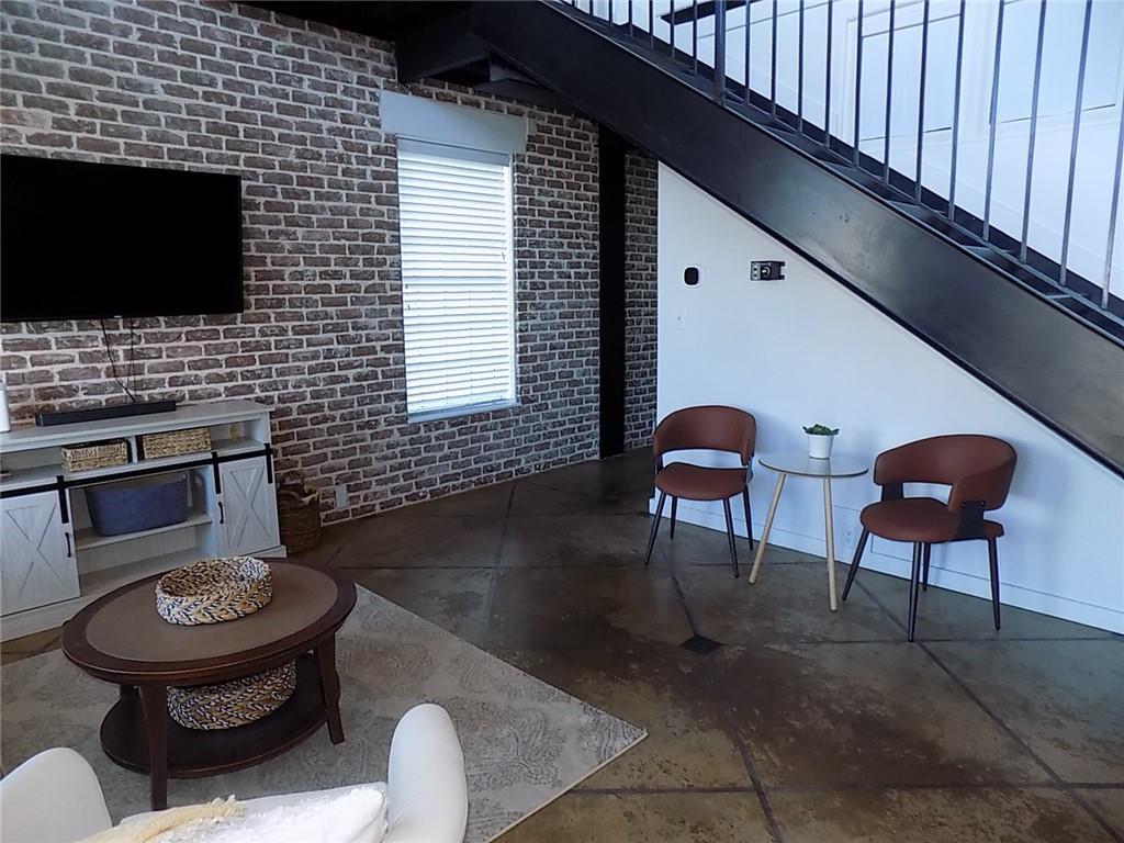 5434 Peachtree Road, Unit 119 Atlanta, GA 30341 - Photo 3 of 44 a living room with furniture and a flat screen tv