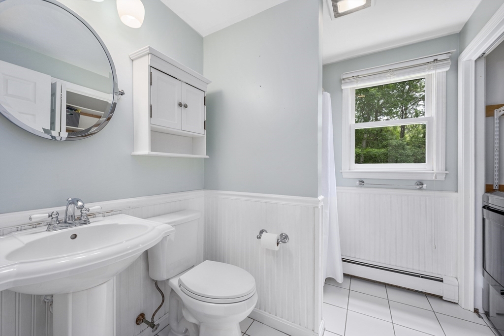 52 Mill Road East Sandwich, MA 02537 - Photo 15 of 36 a bathroom with a sink toilet and a mirror