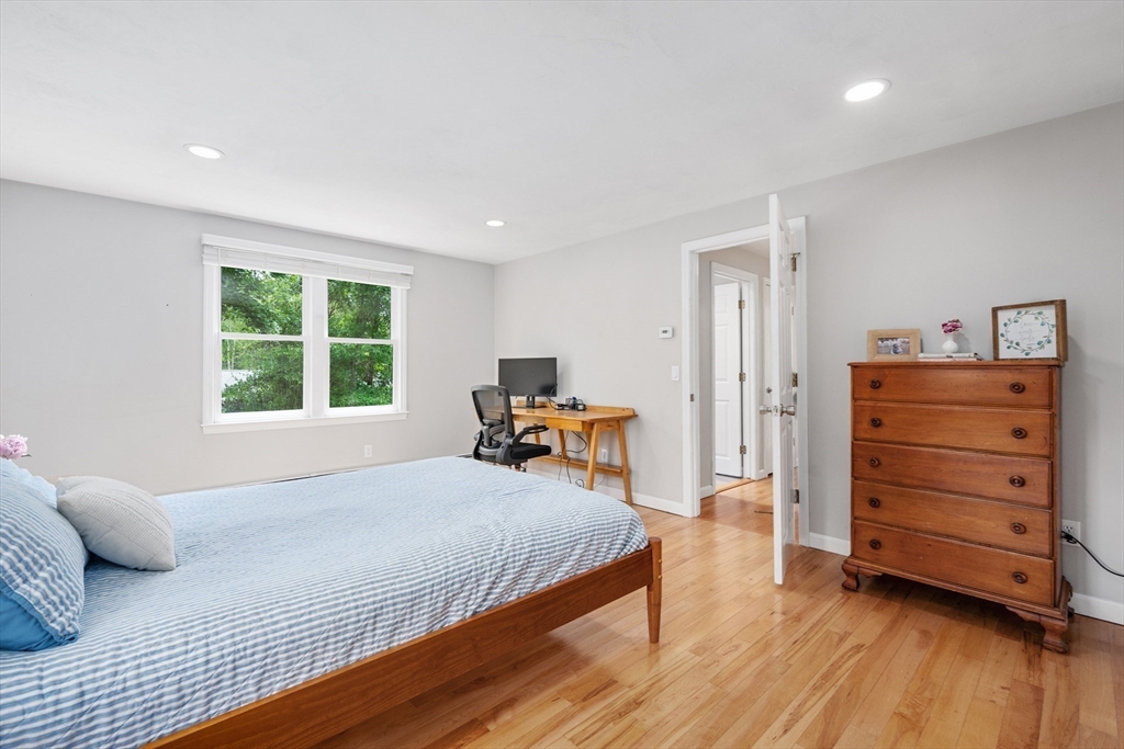 52 Mill Road East Sandwich, MA 02537 - Photo 20 of 36 a bedroom with a bed and wooden floor