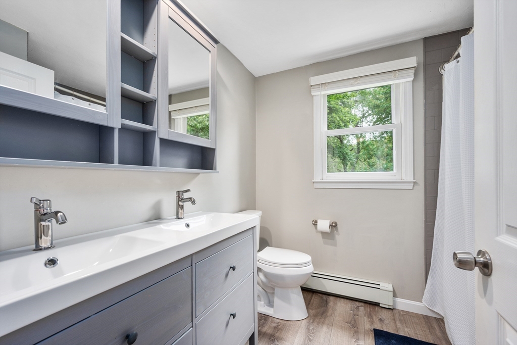 52 Mill Road East Sandwich, MA 02537 - Photo 22 of 36 a bathroom with a sink and a toilet