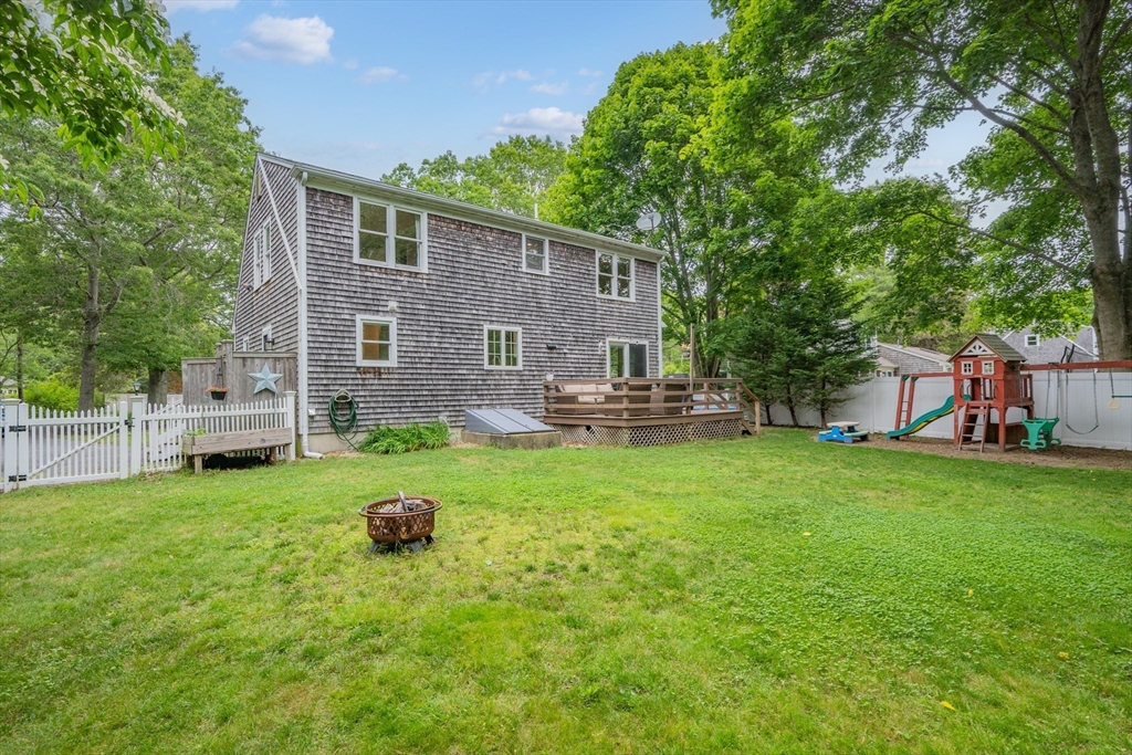 52 Mill Road East Sandwich, MA 02537 - Photo 3 of 36 a front view of house with yard and seating area