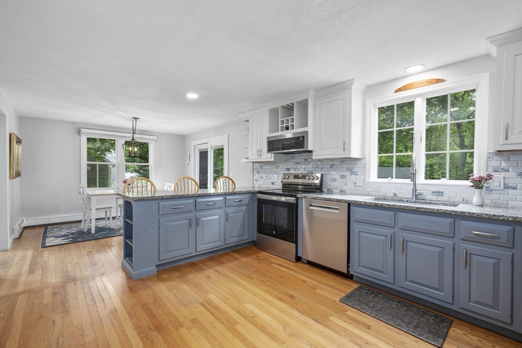 52 Mill Road East Sandwich, MA 02537 - Photo 9 of 36 a kitchen with sink a stove and cabinets