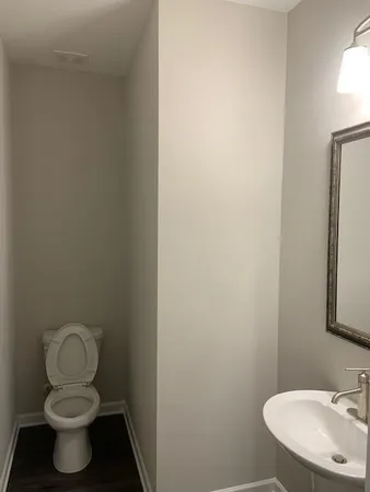 a bathroom with a toilet and a sink