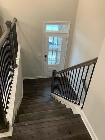 a view of entryway with wooden floor
