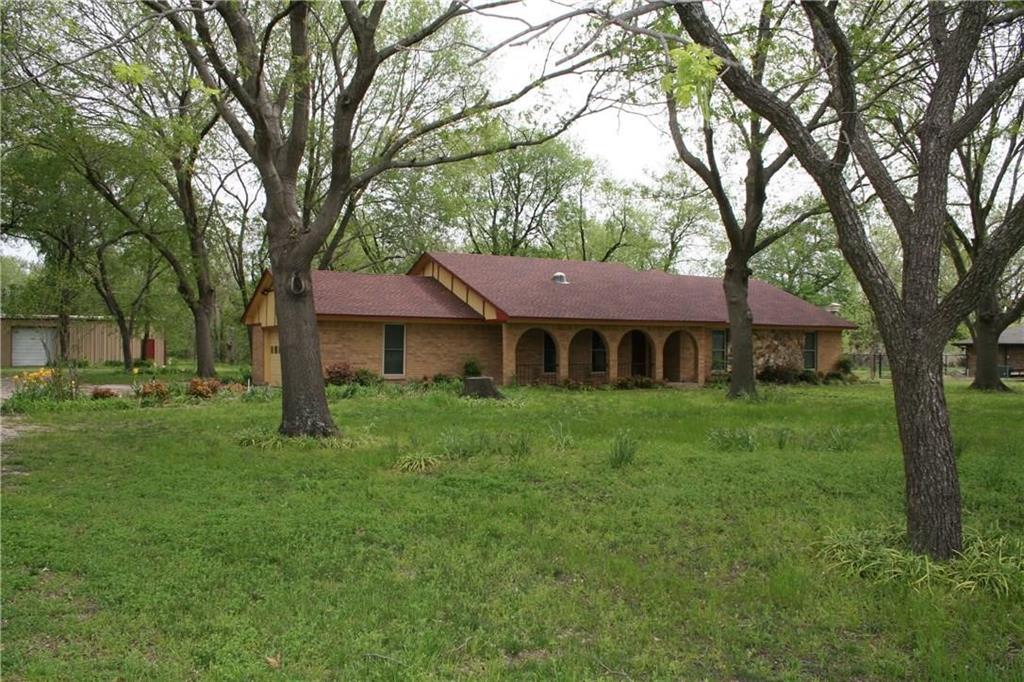2107 Forest Grove Estates Road Allen, TX 75002 - Photo 2 of 13 View of front facade featuring a front lawn, brick siding, and a shingled roof