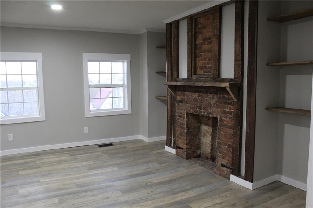73 Beham Ridge Road West Alexander, PA 15376 - Photo 11 of 20 an empty room with wooden floor windows and fireplace