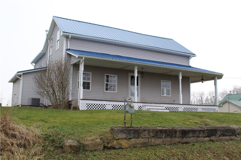 73 Beham Ridge Road West Alexander, PA 15376 - Photo 18 of 20 a front view of a house with a yard