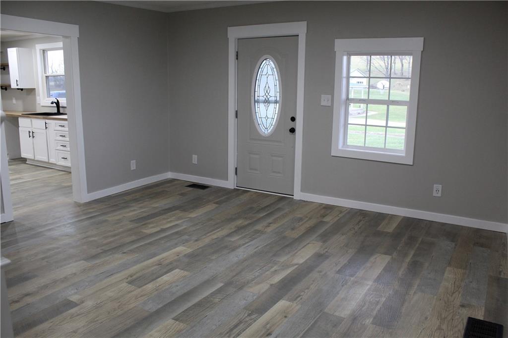 73 Beham Ridge Road West Alexander, PA 15376 - Photo 7 of 20 an empty room with wooden floor and windows