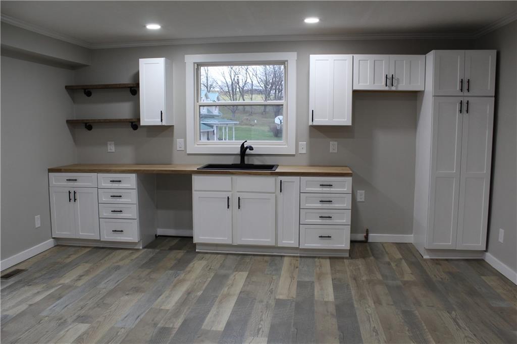 73 Beham Ridge Road West Alexander, PA 15376 - Photo 9 of 20 a kitchen with a stove a refrigerator and a cabinets