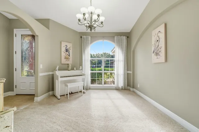 a kitchen with granite countertop a sink a stove and cabinets