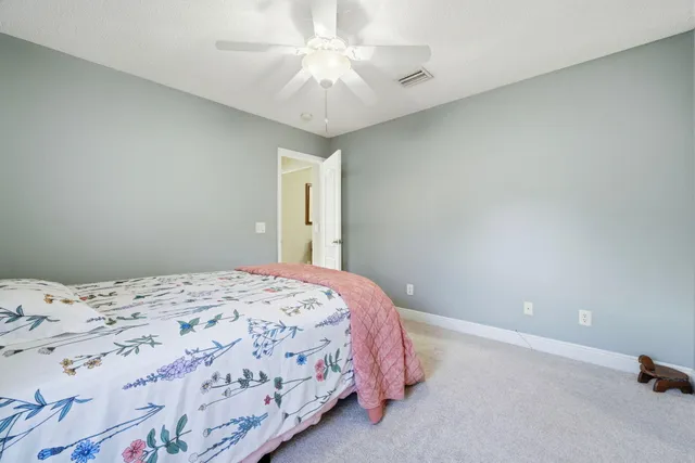 a bed room with a bed and a window