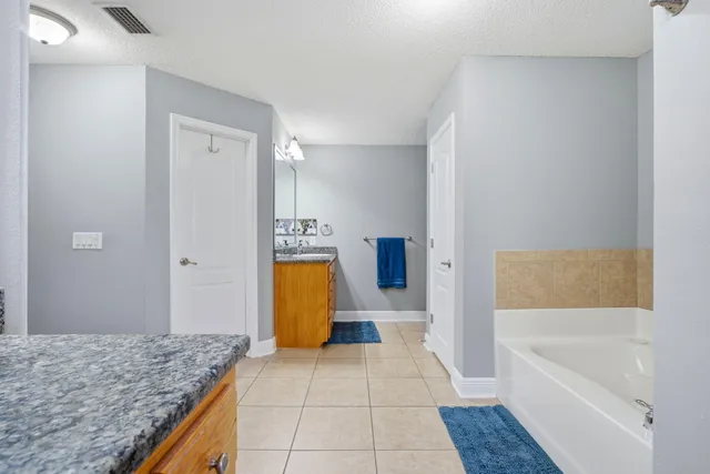 an aerial view of residential houses with outdoor space and river