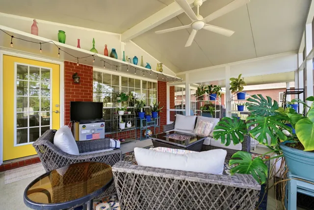 an aerial view of a house with a swimming pool yard and outdoor seating