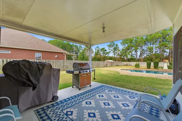 an aerial view of residential houses with outdoor space and river