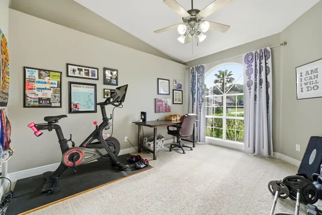 a large kitchen with stainless steel appliances granite countertop a large stove top oven a sink dishwasher a dining table and chairs with wooden cabinets