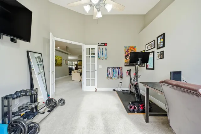 a kitchen with stainless steel appliances kitchen island granite countertop a stove top oven microwave and cabinets