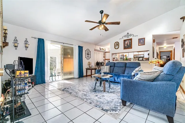 a living room with furniture and flat screen tv