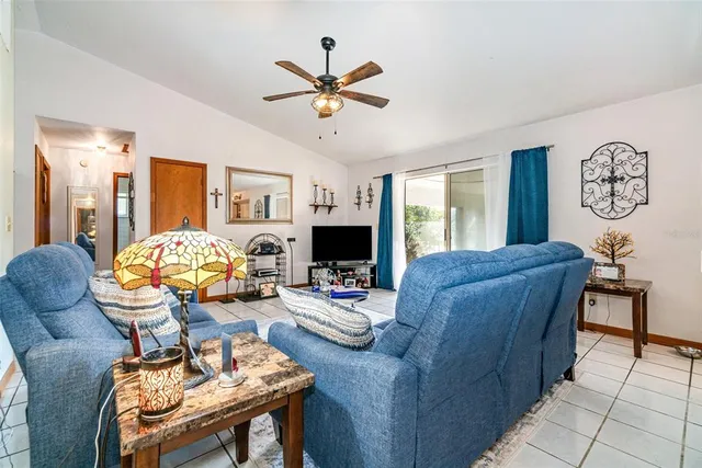 a living room with furniture fireplace and window