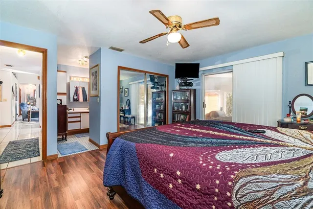 a bedroom with a bed and a walk in closet