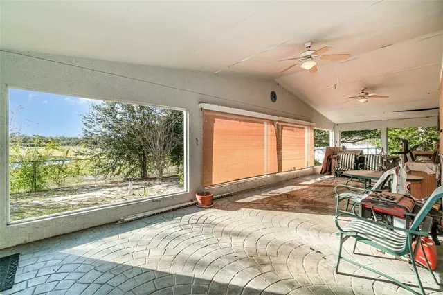 a view of a livingroom with furniture and staircase