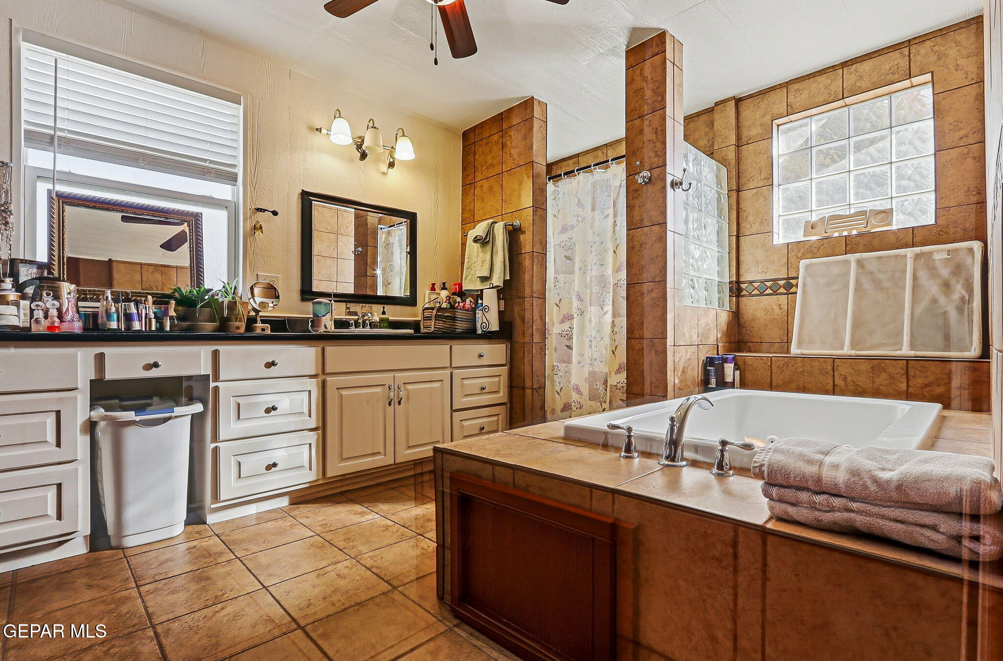 1602 Waterfront Street Anthony, NM 88021 - Photo 29 of 58 a spacious bathroom with a granite countertop sink and a bathtub