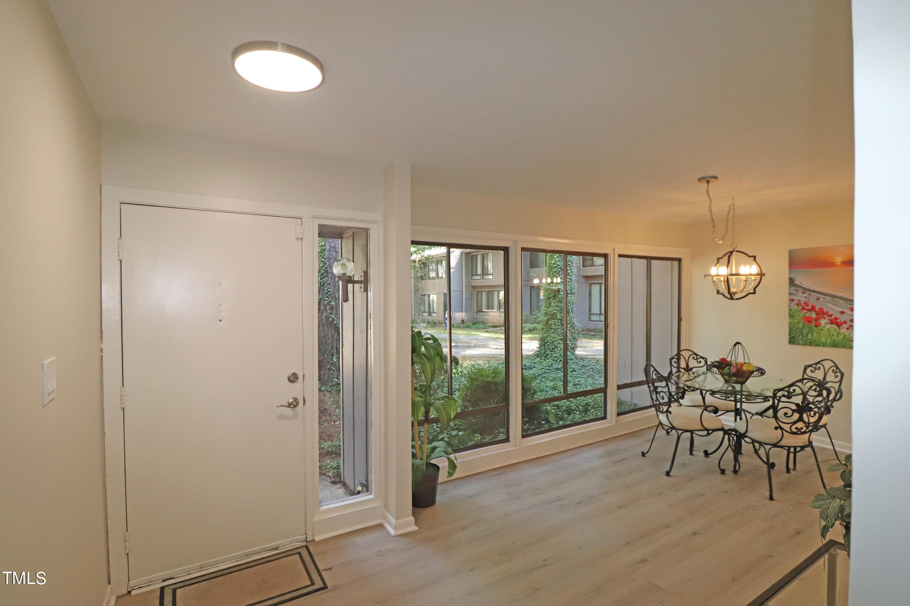 1716 Quail Ridge Road Raleigh, NC 27609 - Photo 15 of 39 a dining room with furniture and a large window