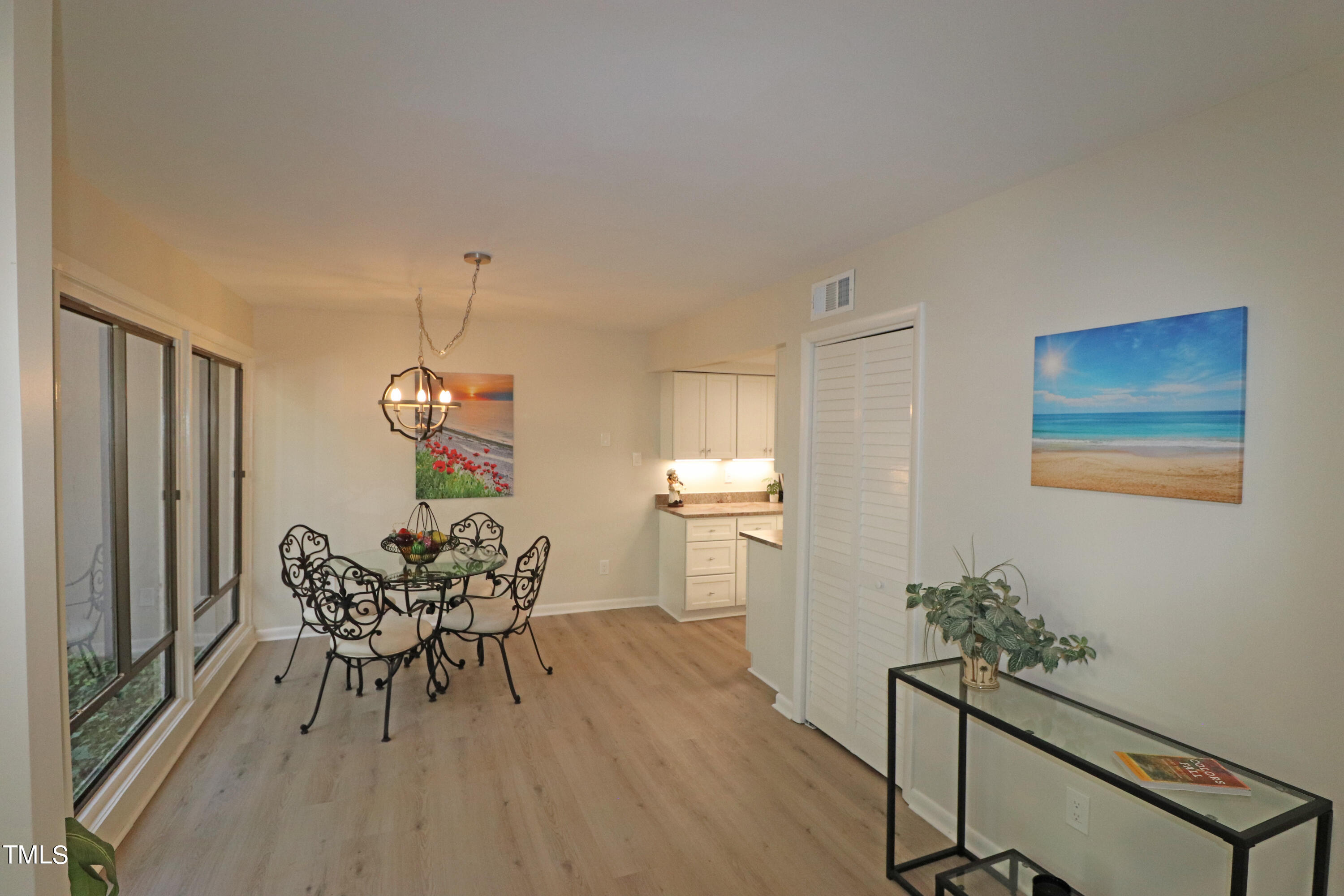 1716 Quail Ridge Road Raleigh, NC 27609 - Photo 16 of 39 a dining room with furniture and wooden floor