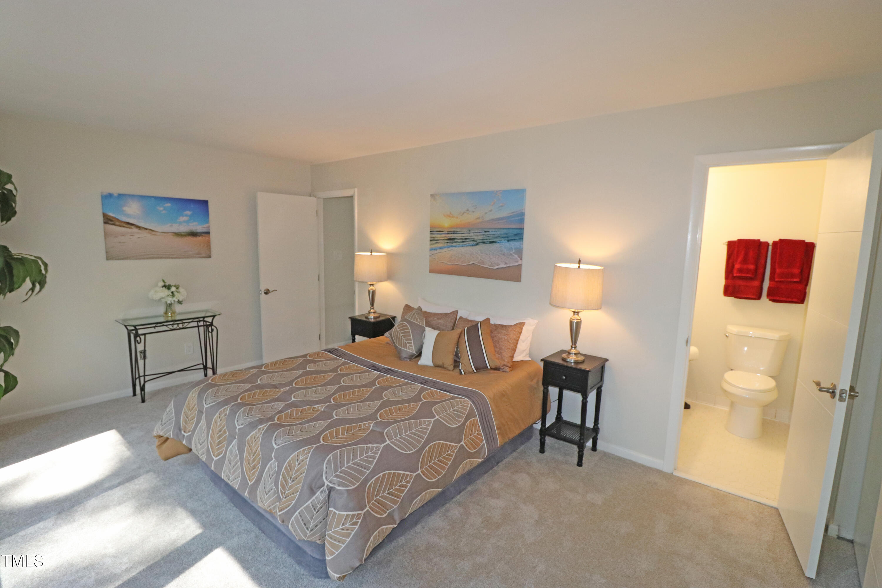 1716 Quail Ridge Road Raleigh, NC 27609 - Photo 27 of 39 a bedroom with a bed and a table in it