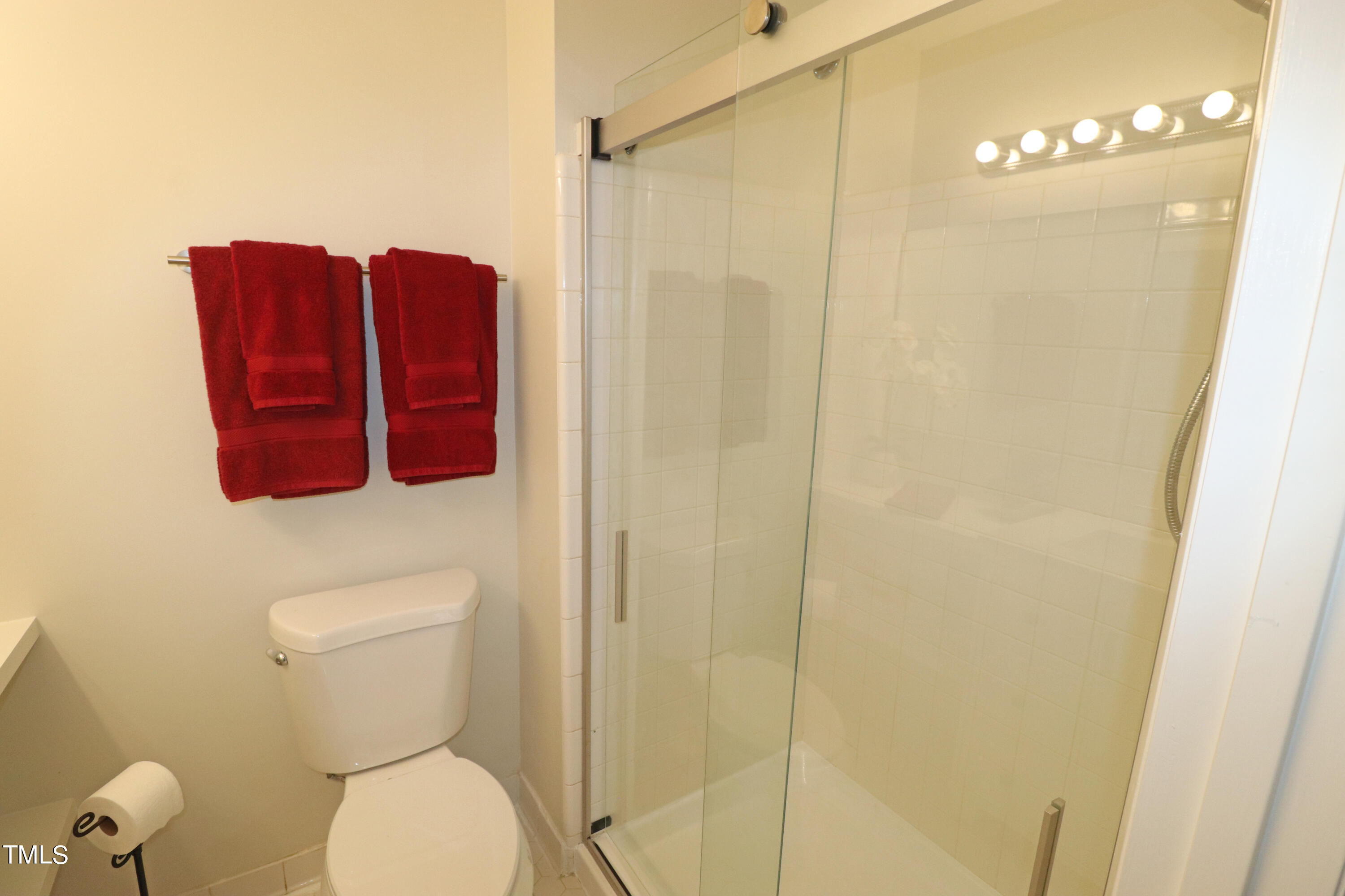 1716 Quail Ridge Road Raleigh, NC 27609 - Photo 30 of 39 a bathroom with a toilet and a shower