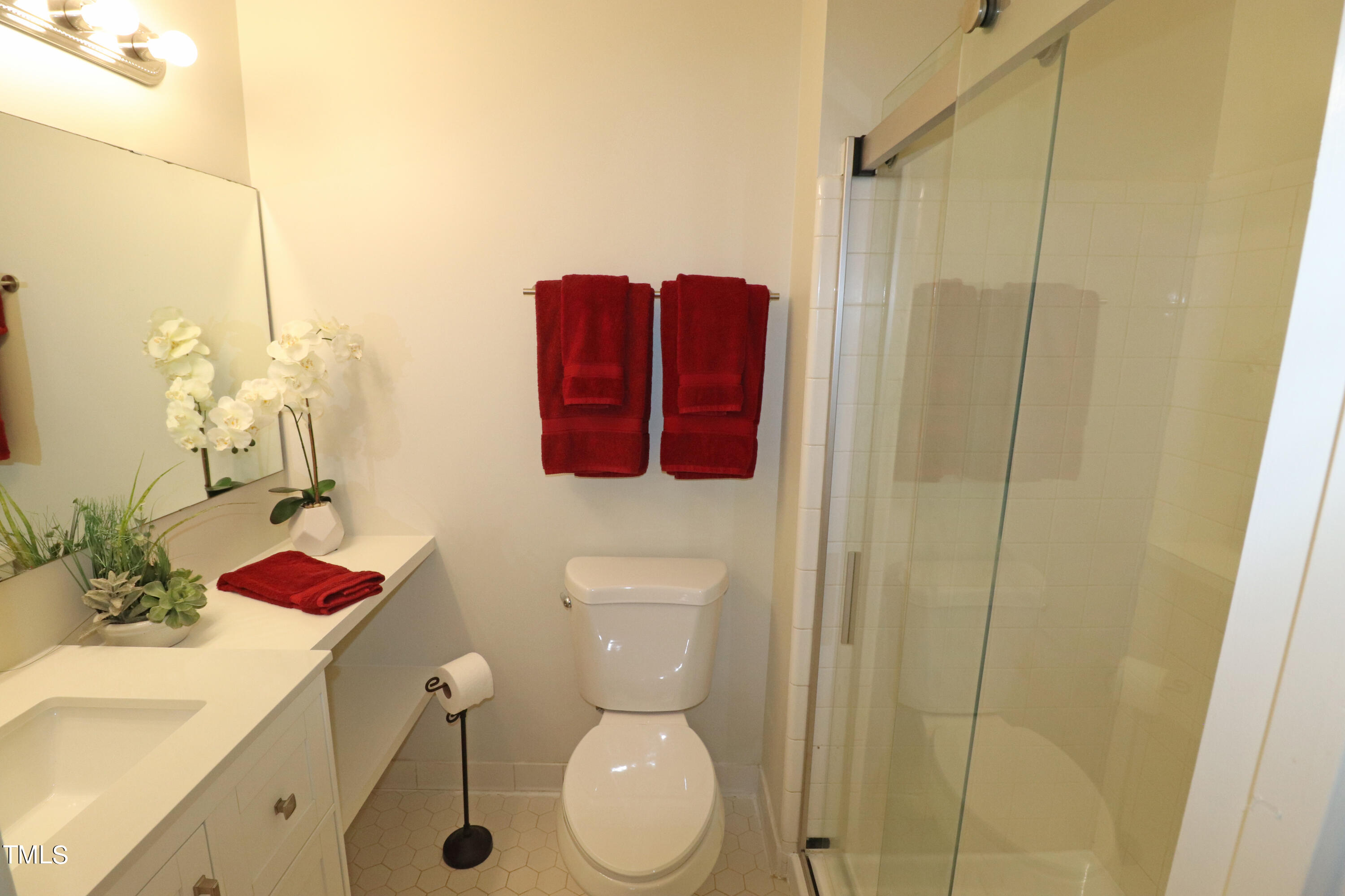 1716 Quail Ridge Road Raleigh, NC 27609 - Photo 31 of 39 a bathroom with a sink toilet and shower