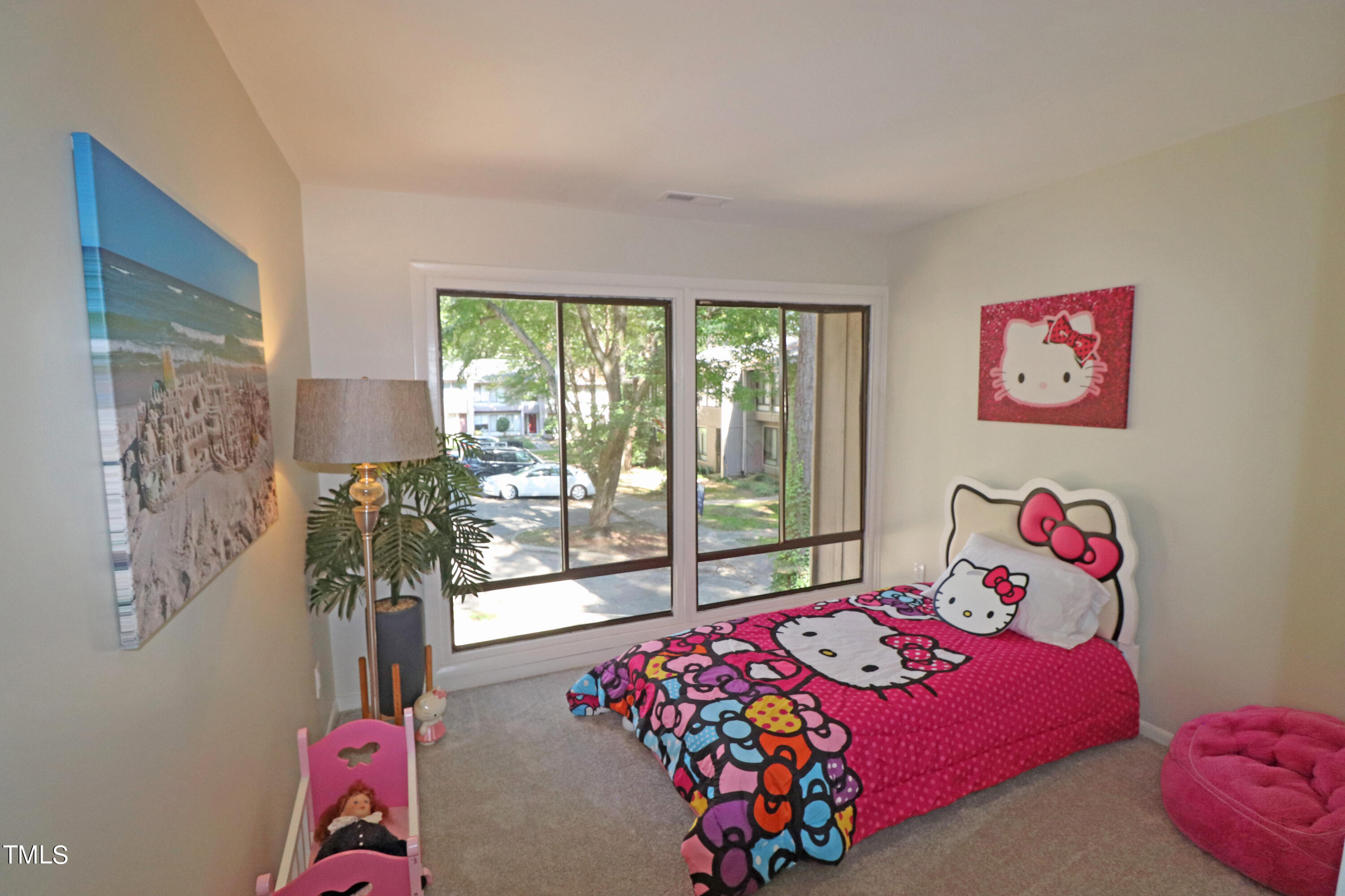 1716 Quail Ridge Road Raleigh, NC 27609 - Photo 32 of 39 a bedroom with a bed and a painting on the wall