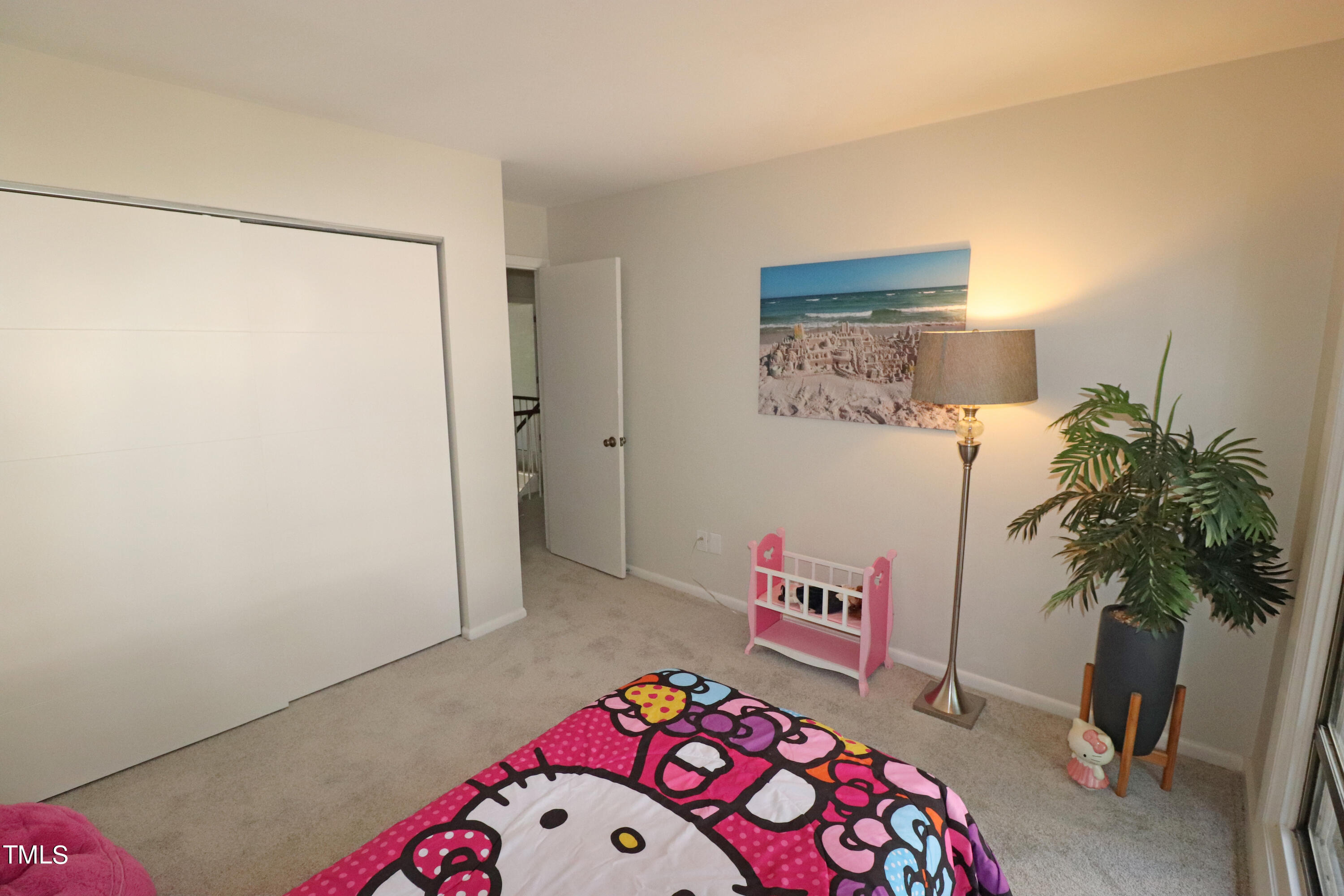 1716 Quail Ridge Road Raleigh, NC 27609 - Photo 34 of 39 a bedroom with a bed and a potted plant