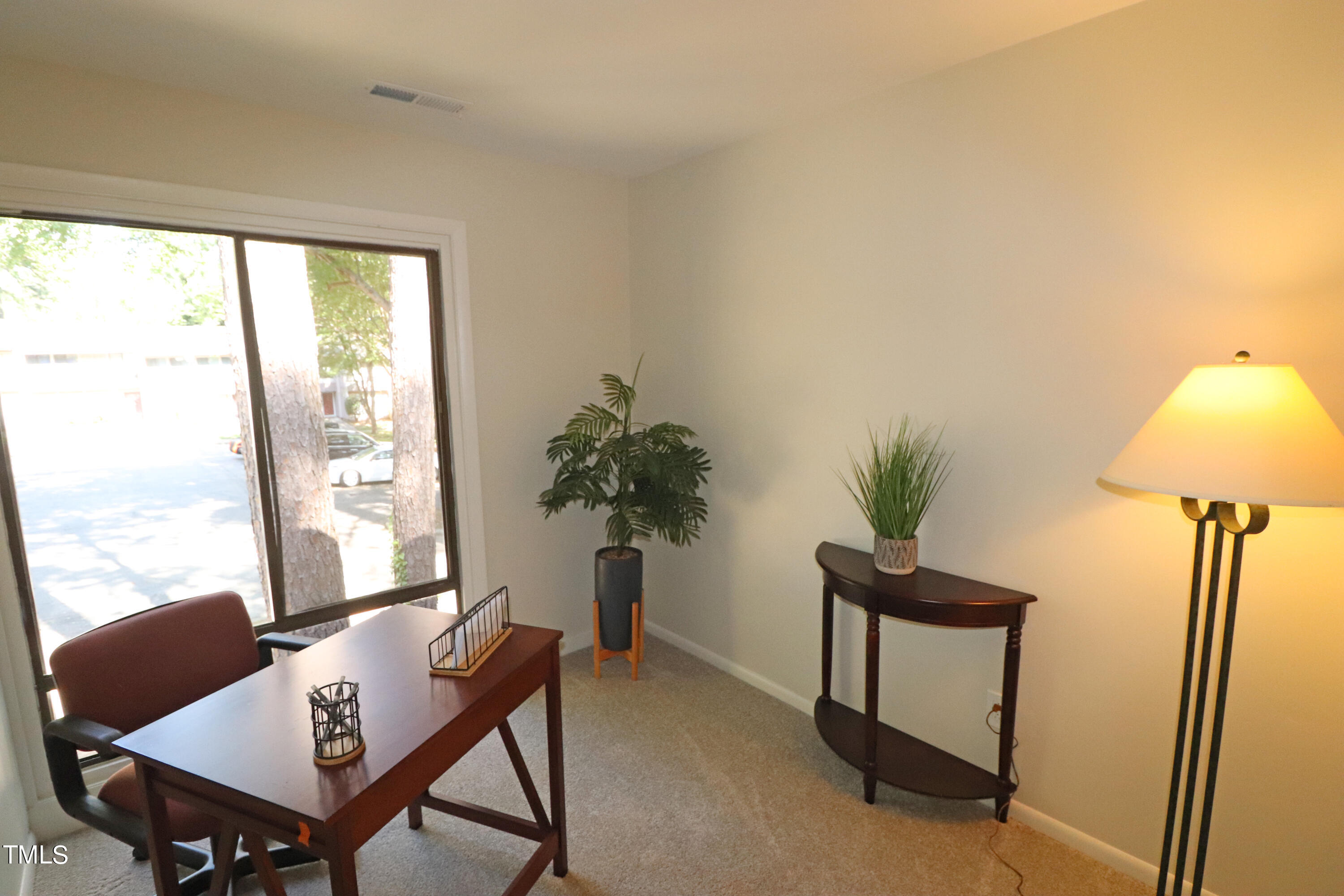 1716 Quail Ridge Road Raleigh, NC 27609 - Photo 37 of 39 a view of a workspace with furniture and a window