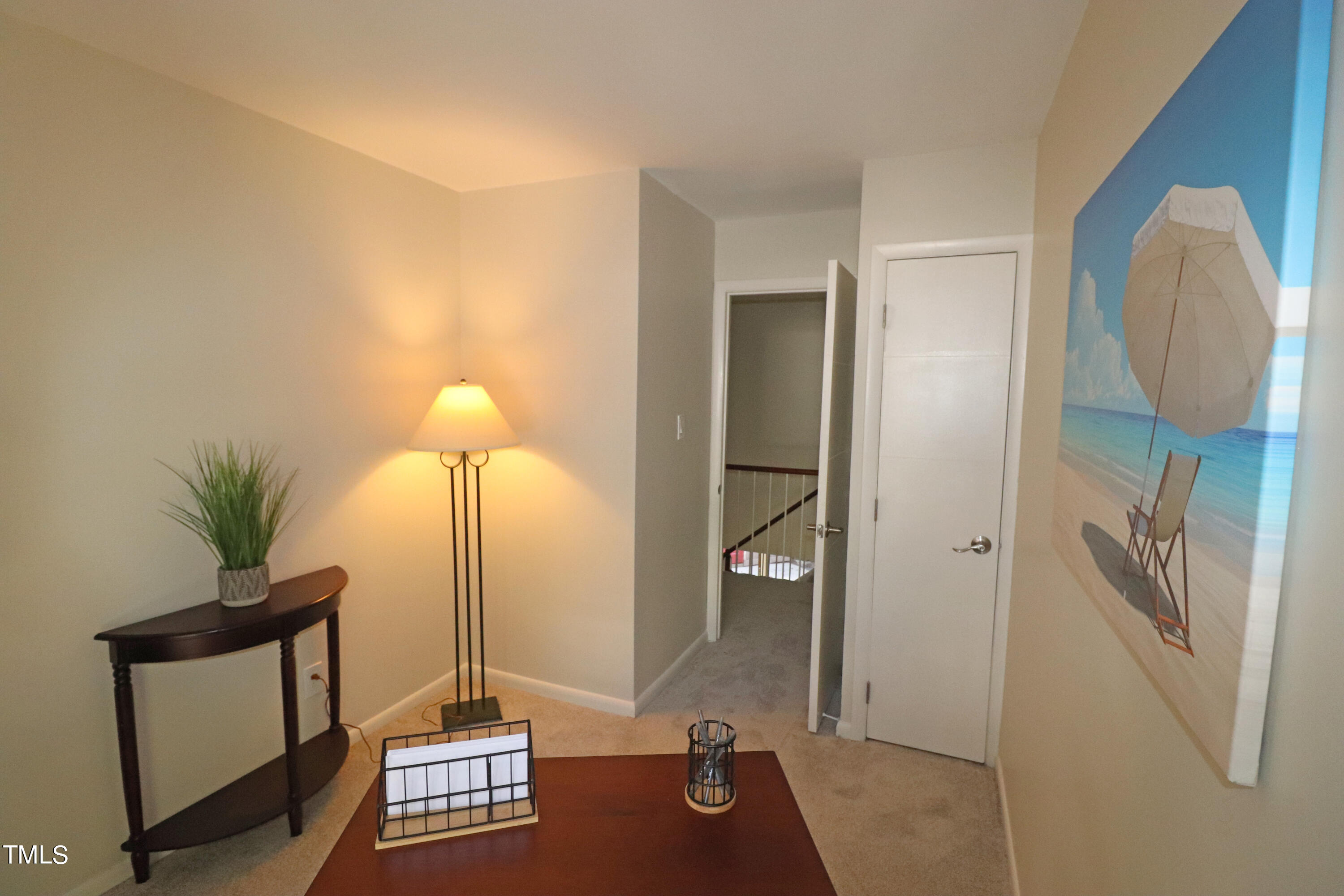 1716 Quail Ridge Road Raleigh, NC 27609 - Photo 39 of 39 a view of a hallway with paintings on the wall