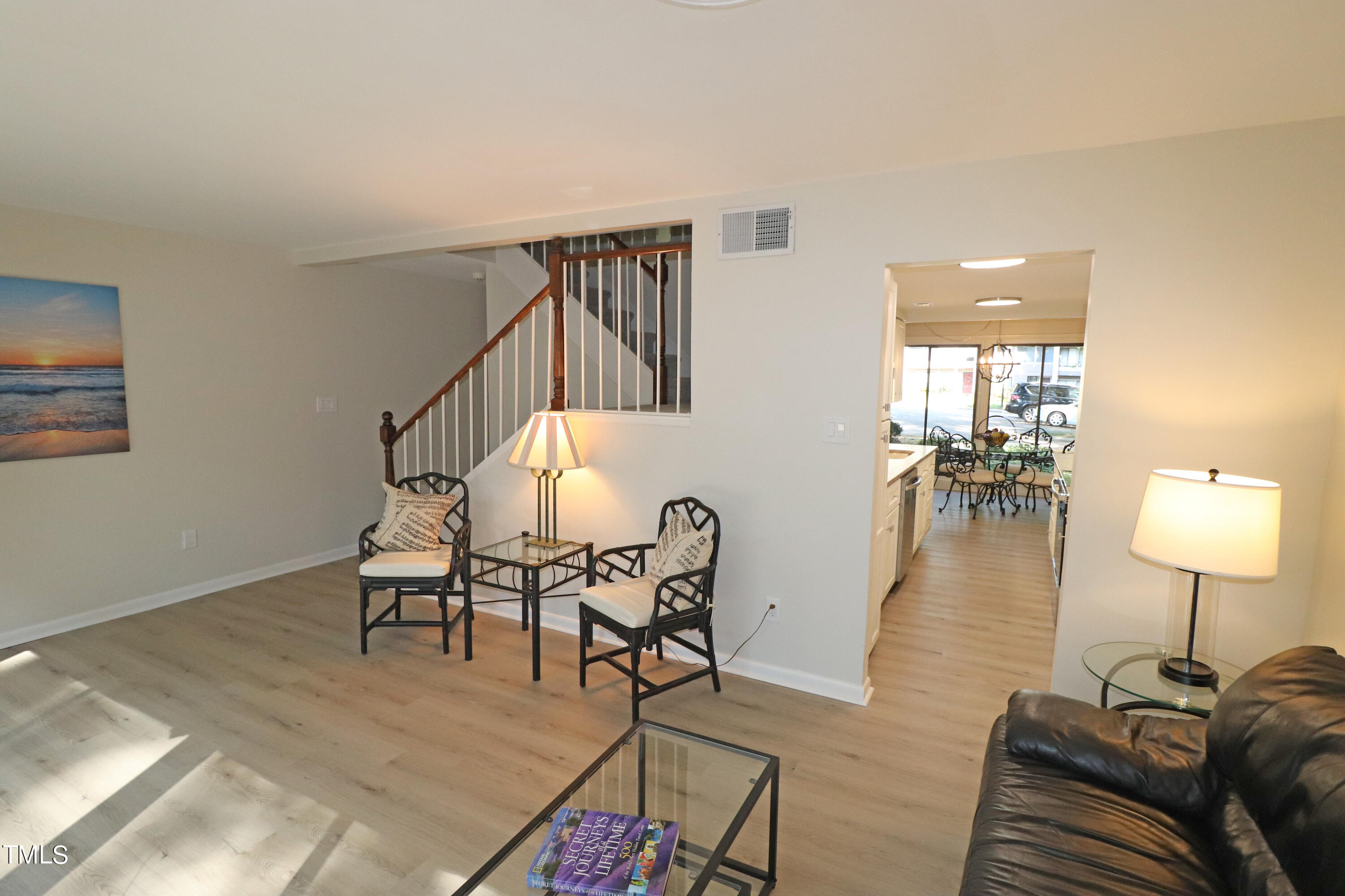 1716 Quail Ridge Road Raleigh, NC 27609 - Photo 5 of 39 a view of a livingroom with furniture and a lamp