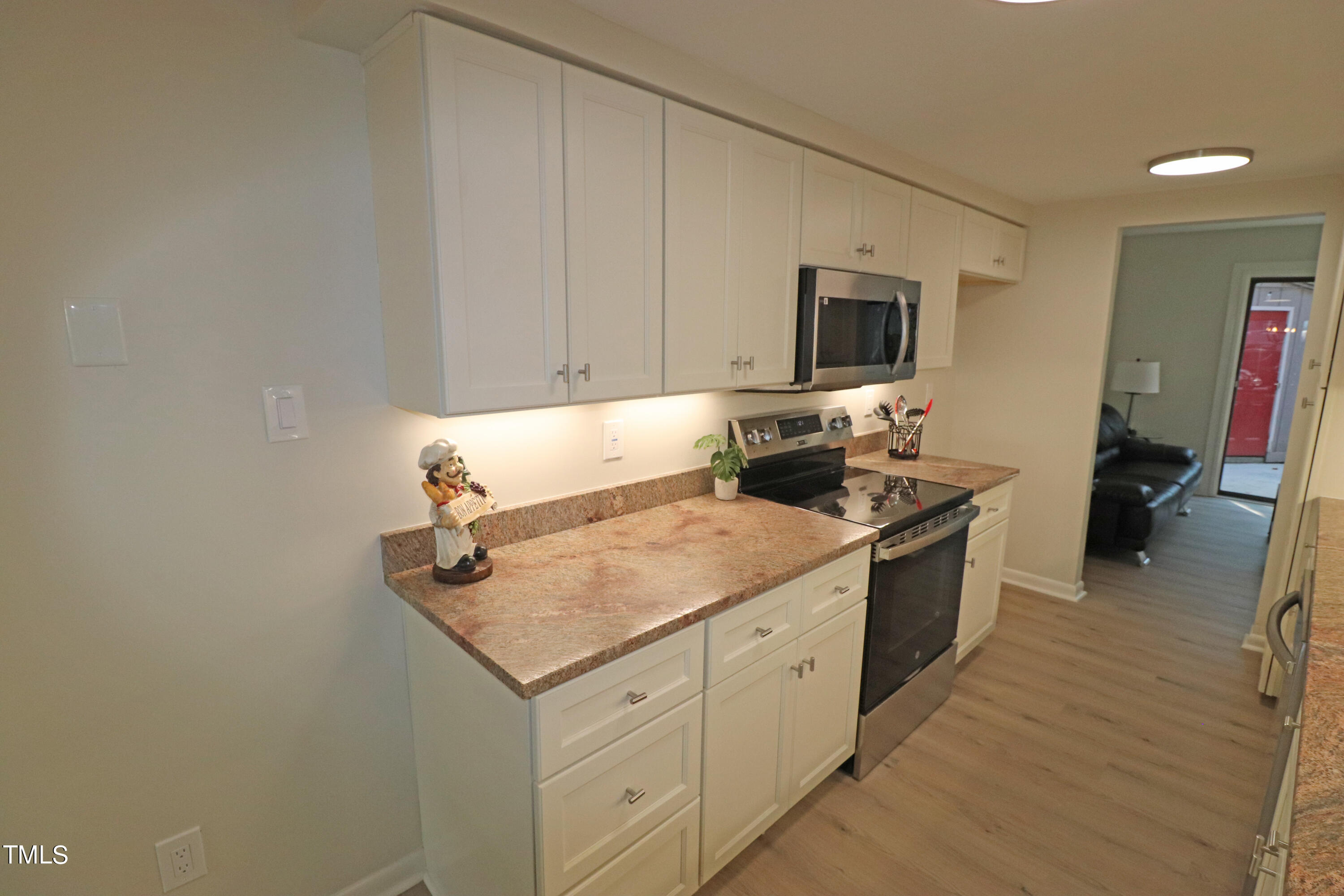 1716 Quail Ridge Road Raleigh, NC 27609 - Photo 9 of 39 a kitchen with a sink and cabinets