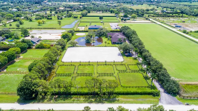 an aerial view of a golf course with a big yard