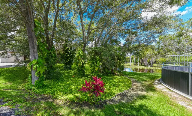 a view of outdoor space with deck and yard