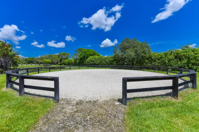 a view of a golf course with a swimming pool