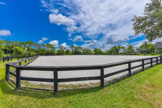 a view of a golf course with chairs