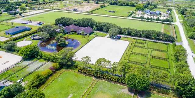 a view of a swimming pool with a yard