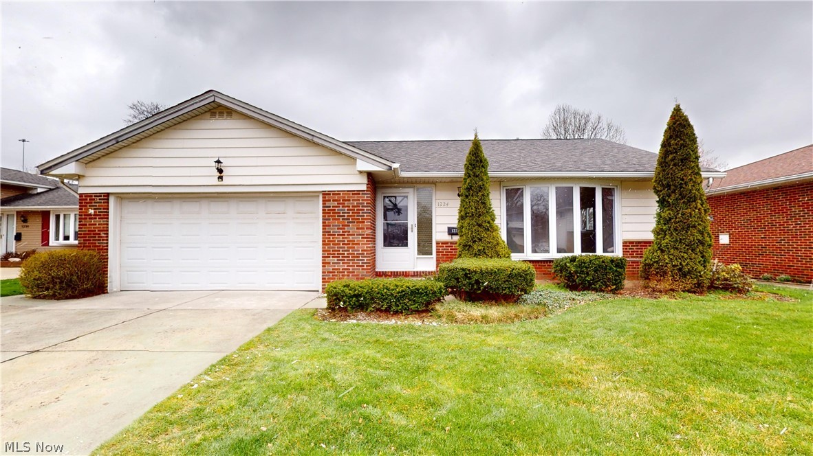 1224 Cordova Road Mayfield Heights, OH 44124 - Photo 1 of 29 Ranch-style home featuring a front yard and a garage
