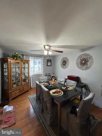 a dining room with furniture and a window
