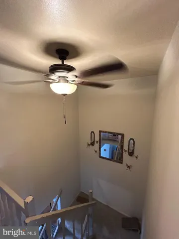 a view of a hallway with a window