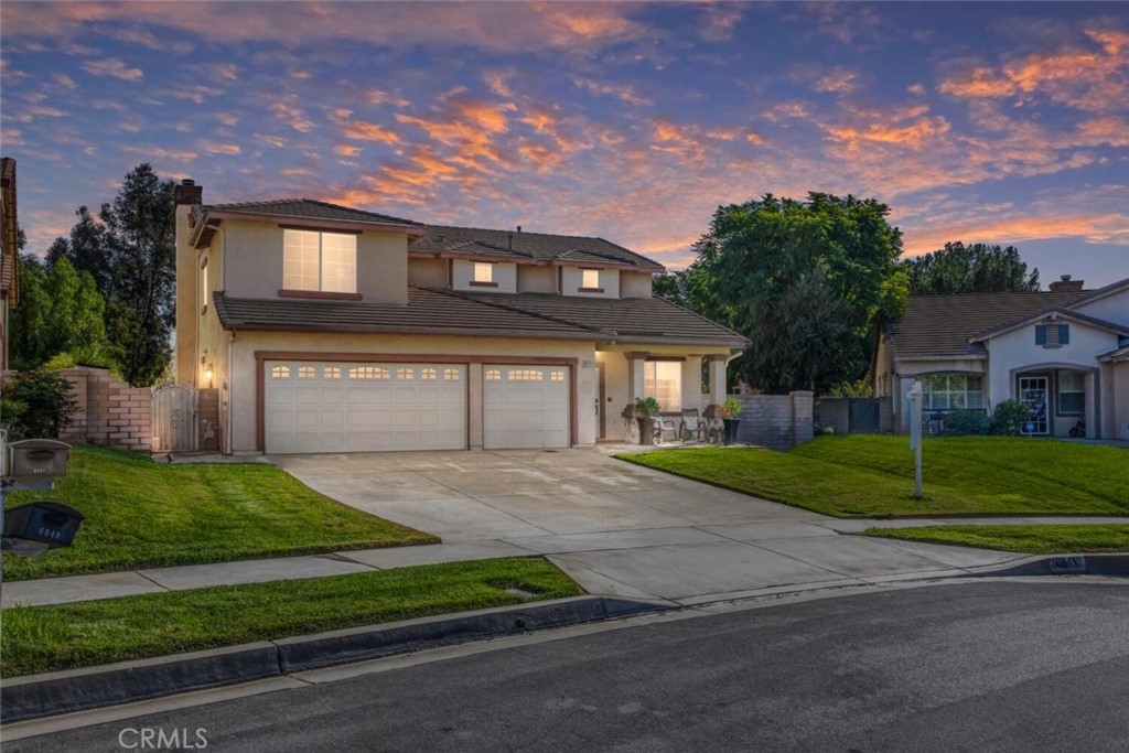 6841 Springview Place Rancho Cucamonga, CA 91701 - Photo 1 of 1 a front view of a house with a yard and garage
