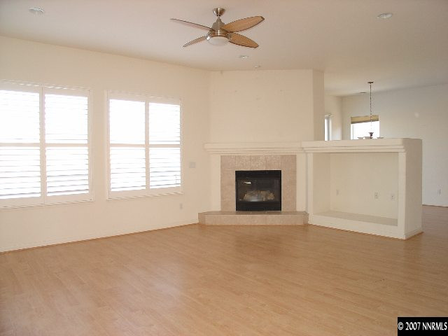 1637 Moquith Court Reno, NV 89521 - Photo 4 of 7 a view of empty room with a fireplace and fan